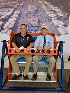 Marty Biniasz takes a ride on the Sky Wheel with E. James Strates of the famous Strates Shows