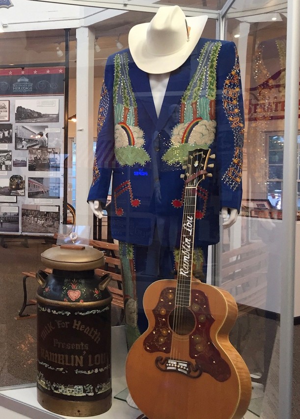2016 - A display dedicated to Ramblin' Lou Schriver included his "Nudie Suit." The stage outfit was made by Nuta Kotlyarenko, known professionally as Nudie Cohn